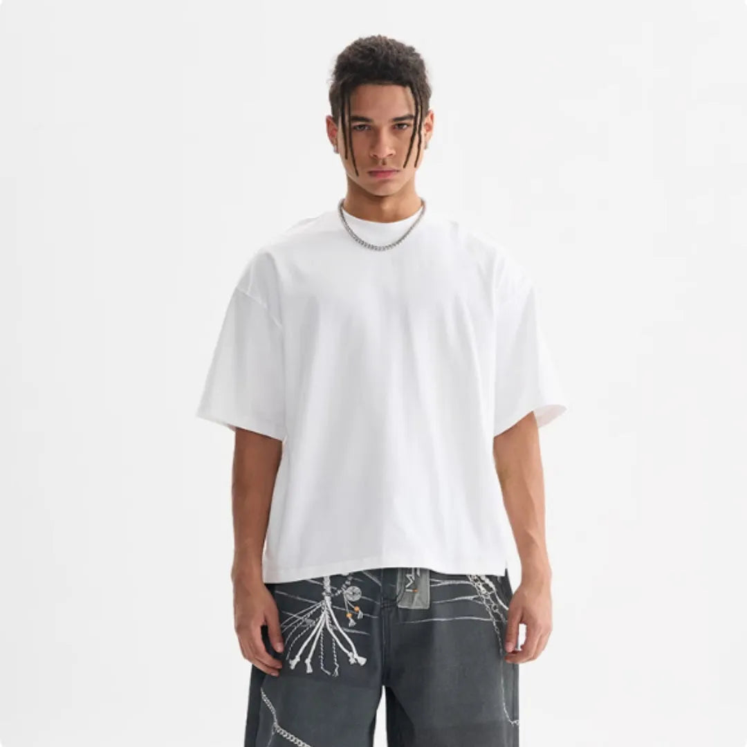 American style loose fit pure cotton T-shirt shown in apricot colour on a model.