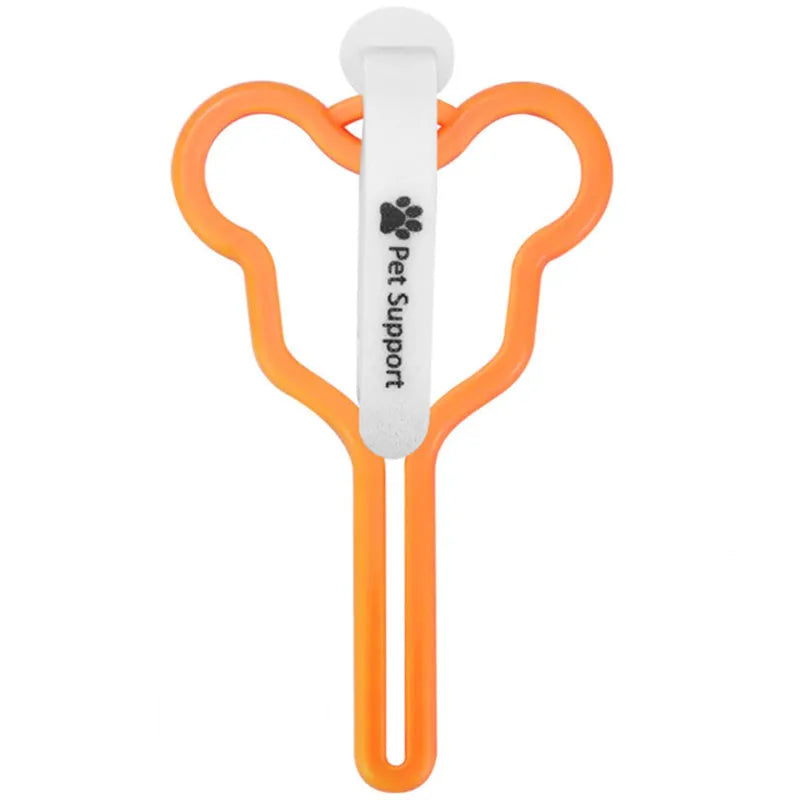 A hands-free dog poop bag holder with a hook and loop fastener strap, shown attached to a dog leash.