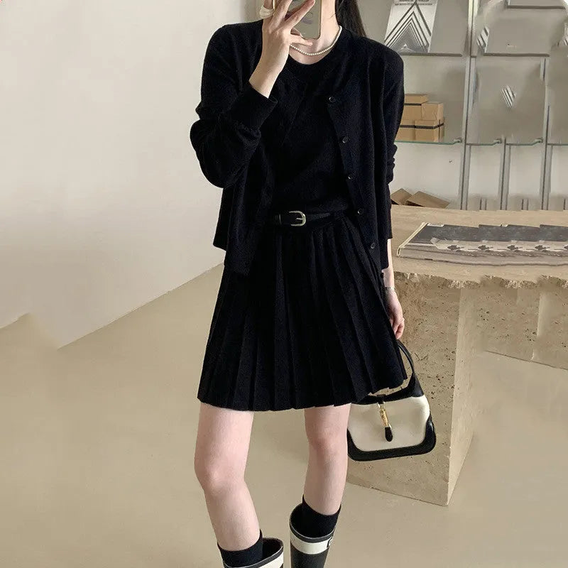 Grey art retro knitted two-piece set with 3D pattern, featuring a pleated vest skirt and long-sleeved cardigan with an adjustable belt.