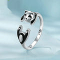 Adjustable sterling silver panda ring with white gold plating on an open band.