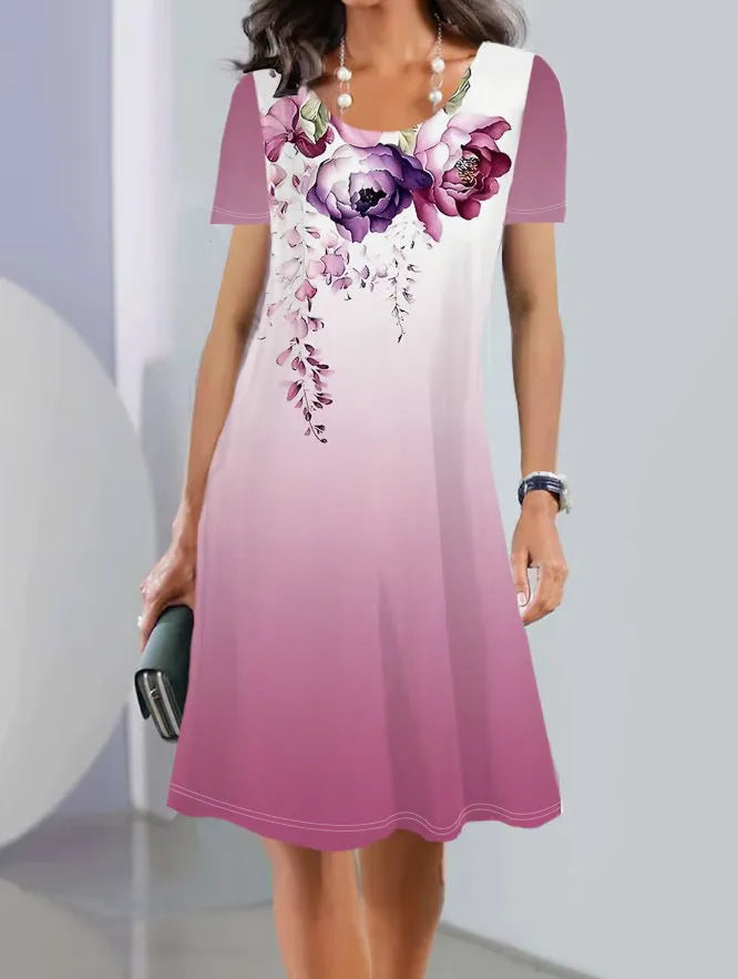 Women's floral print summer dress with short sleeves and a mid-length A-line skirt.
