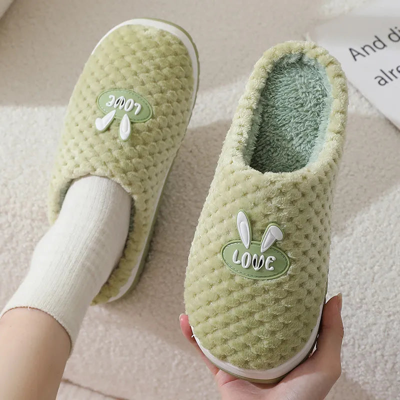 Women's rabbit plaid artificial fur house slippers with a flat heel and rubber sole, shown in apricot colour.