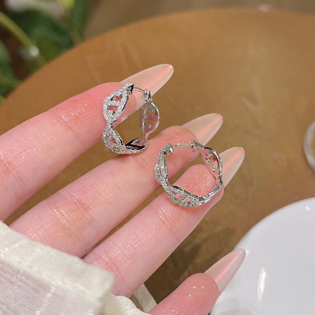 Women's diamond-design electroplated copper earrings in silver, gold, or rose gold finish.