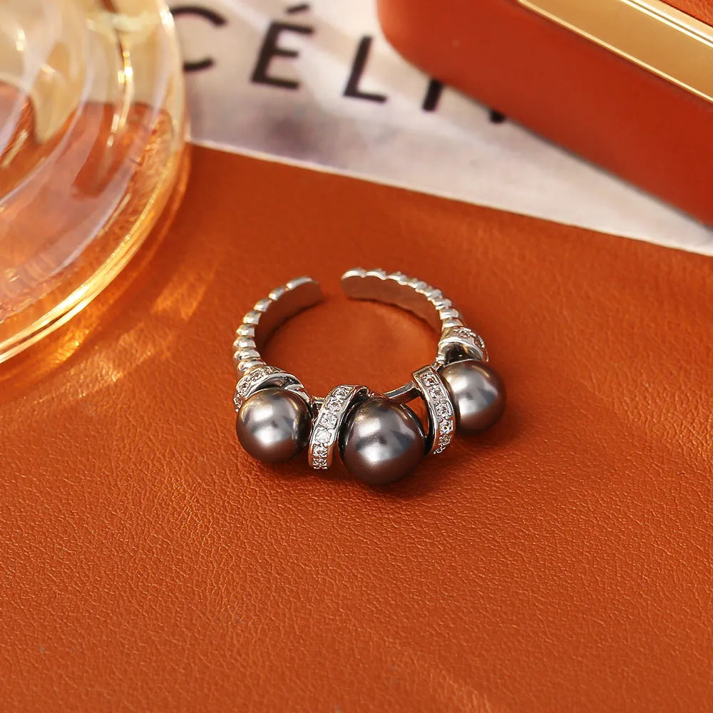 Open-end ring with round pearl element in grey colour, real gold plated copper base, unisex geometric style