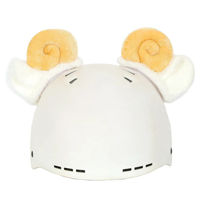 Colourful plush cartoon hat decoration sitting on top of a ski helmet