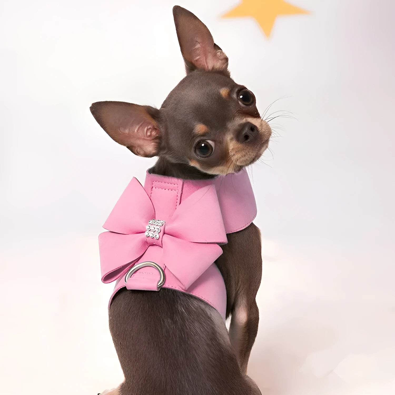 Cute pink bowknot chest strap for a small dog on a white background.