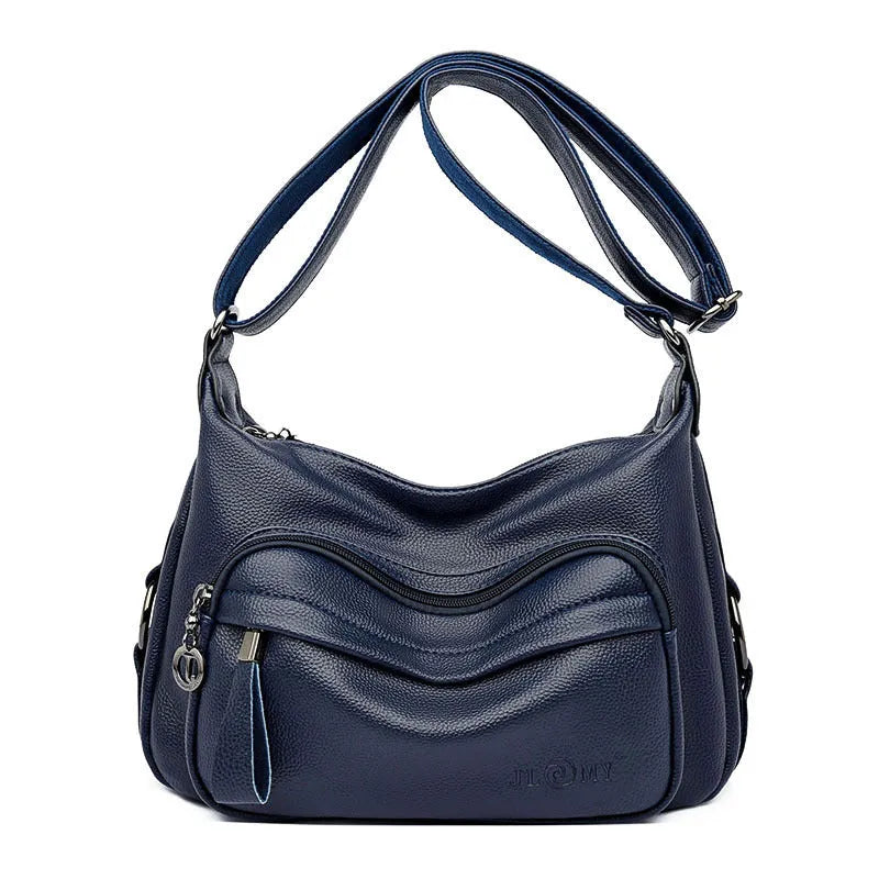 Large blue soft PU women's shoulder bag with a zipper and organised interior compartments.