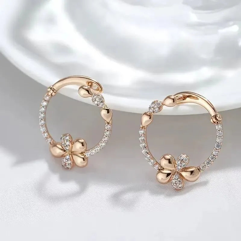 A pair of women's round geometric ring earrings in copper with an electroplated EK13286-FD-01 colour finish.