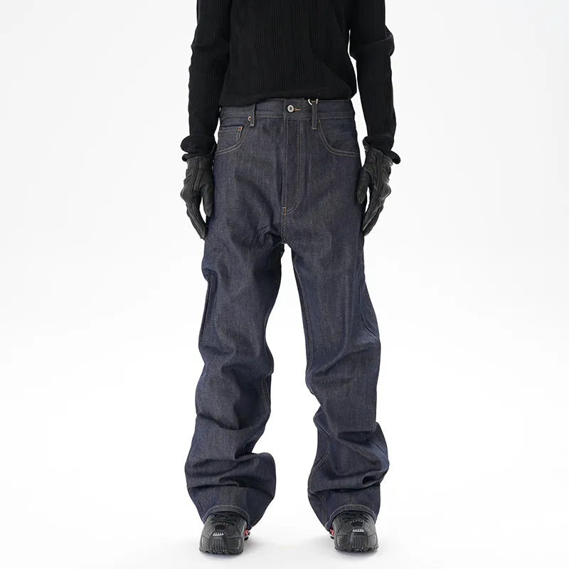 Man's dark blue loose straight-leg casual jeans on a white background.
