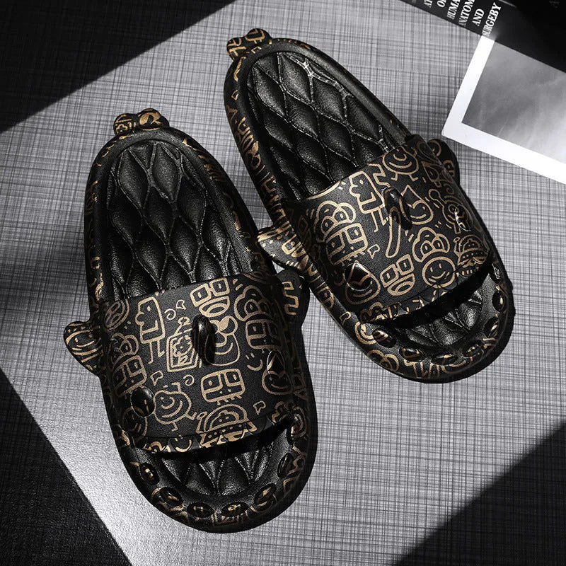 Pair of grey open-toe EVA slippers with raised shark design on the front, shown on a wooden floor.