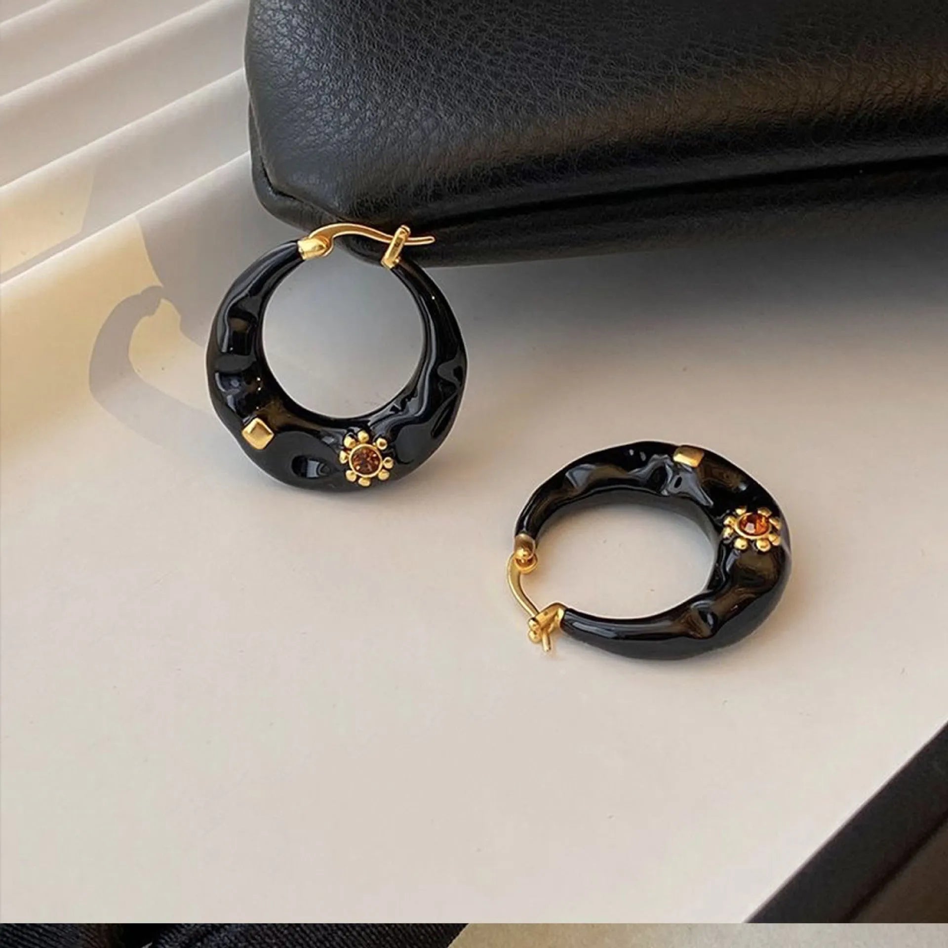 Retro alloy ear studs with dripping oil texture and rhinestone decorations in black or red colours