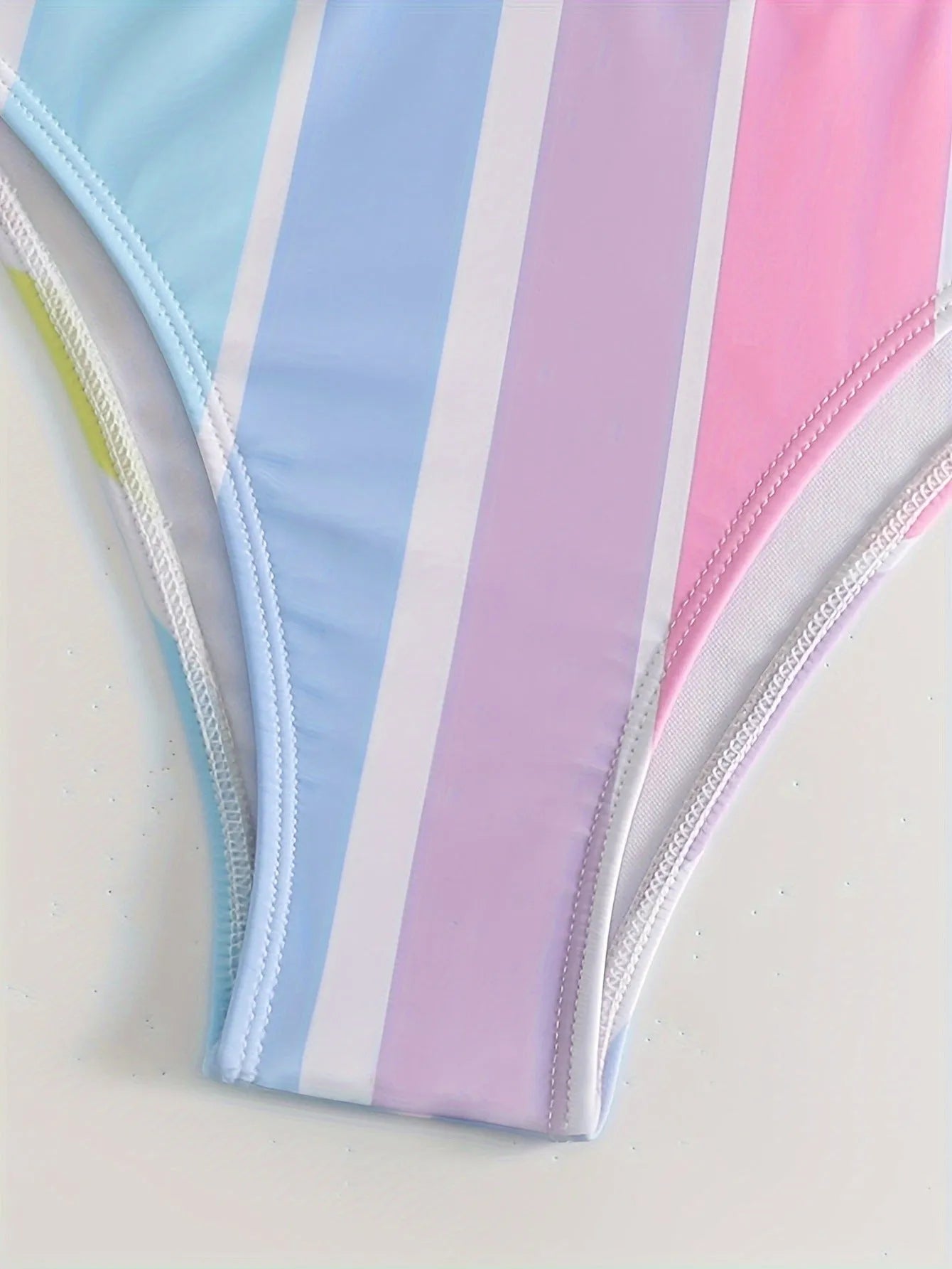 Women's striped bikini top and briefs in picture colour, laid flat to show pattern and style.