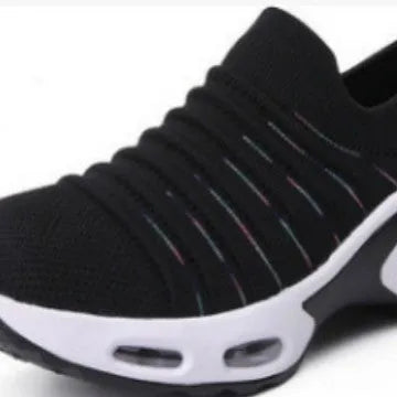 Women's plus size fly-knit socks shoes in stretch mesh with low heel and round toe.
