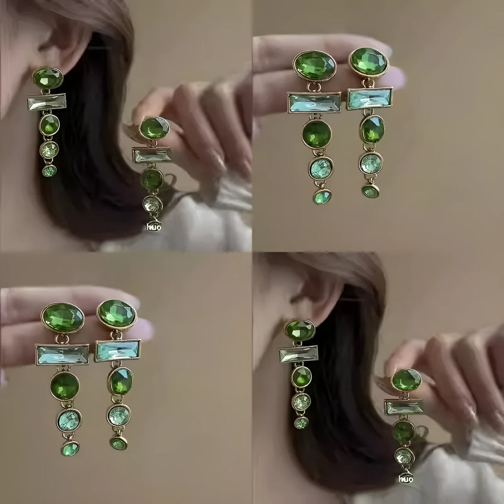 Retro green gradient geometric stud earrings with long silver tassel drop on a white background.