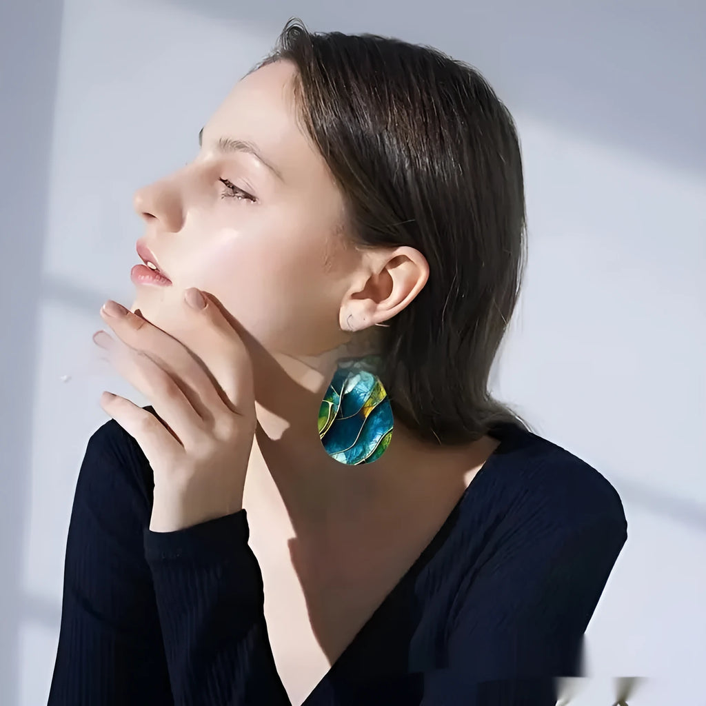 A pair of trendy acrylic drop earrings with a flat branch knot design, shown in style 1 and style 2 variations.