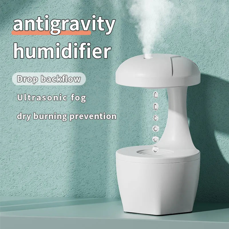 White portable 800ml USB humidifier with anti-gravity cool mist droplet effect for bedroom aromatherapy