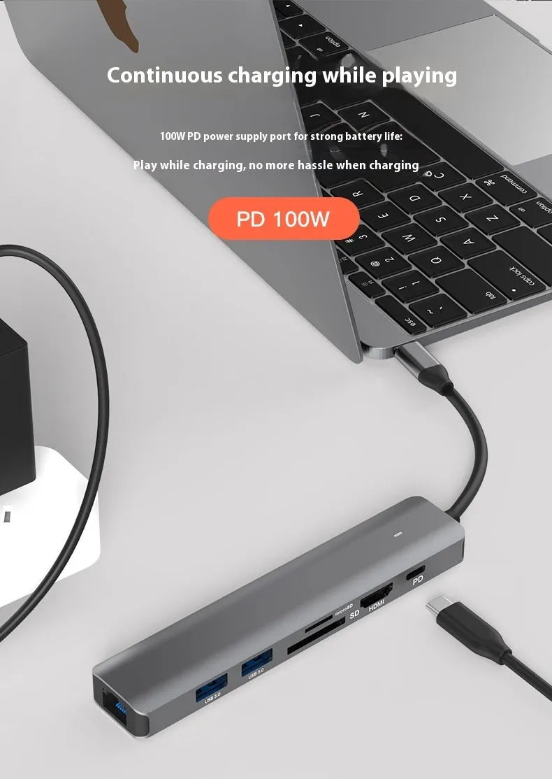 LQT-LH07 7-in-1 card reader and USB-C PD computer hub on a desk next to a laptop.