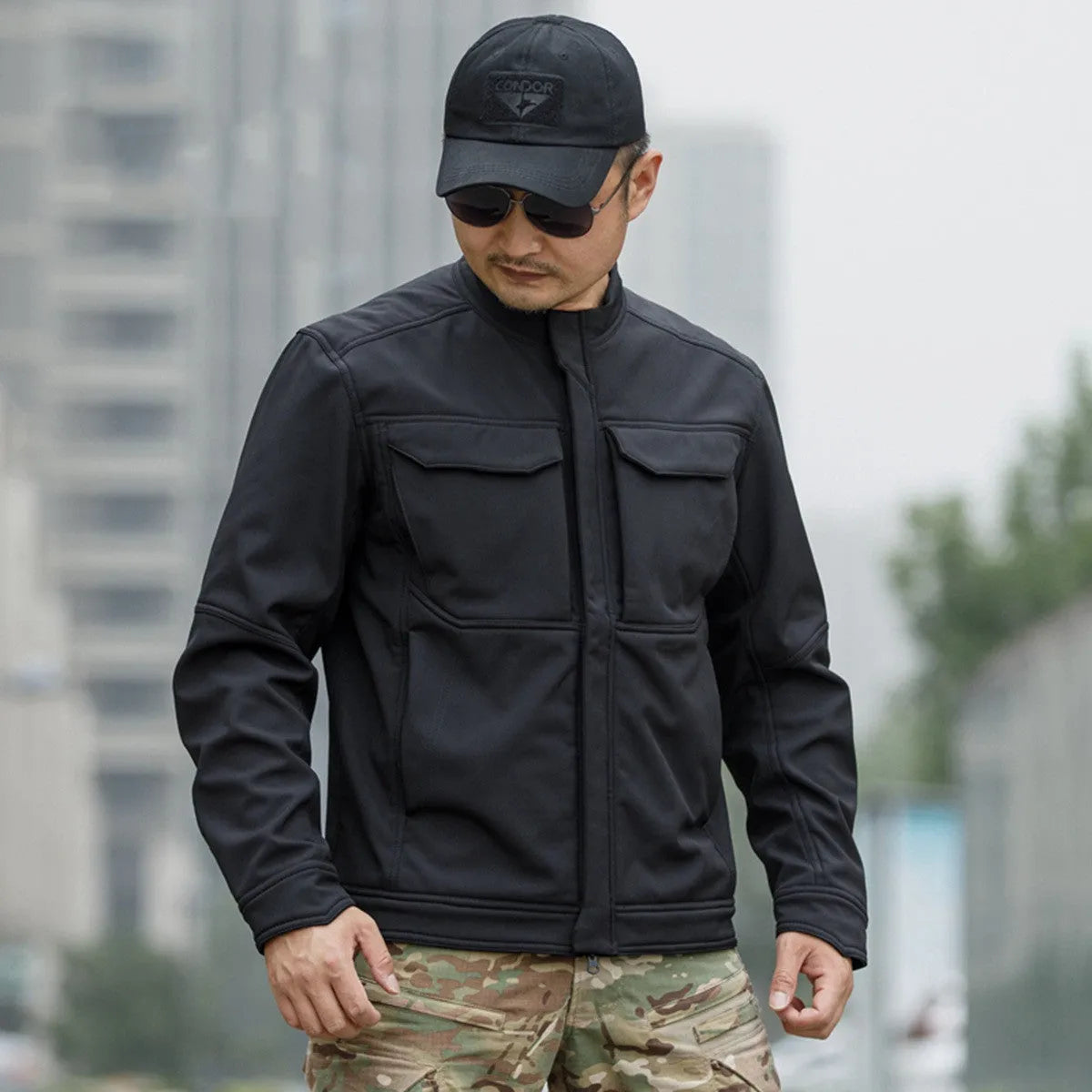 Bone Frog Peak Breaker soft shell tactical jacket in black camouflage for mountaineering.