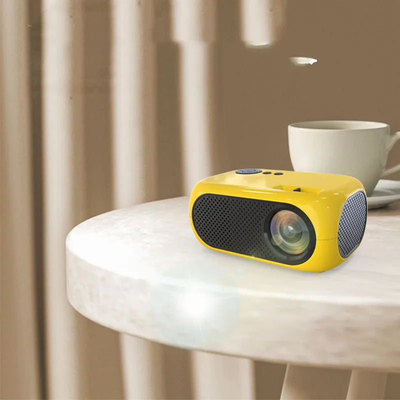M24 portable micro mini LED projector in gold or white colour on a grey background
