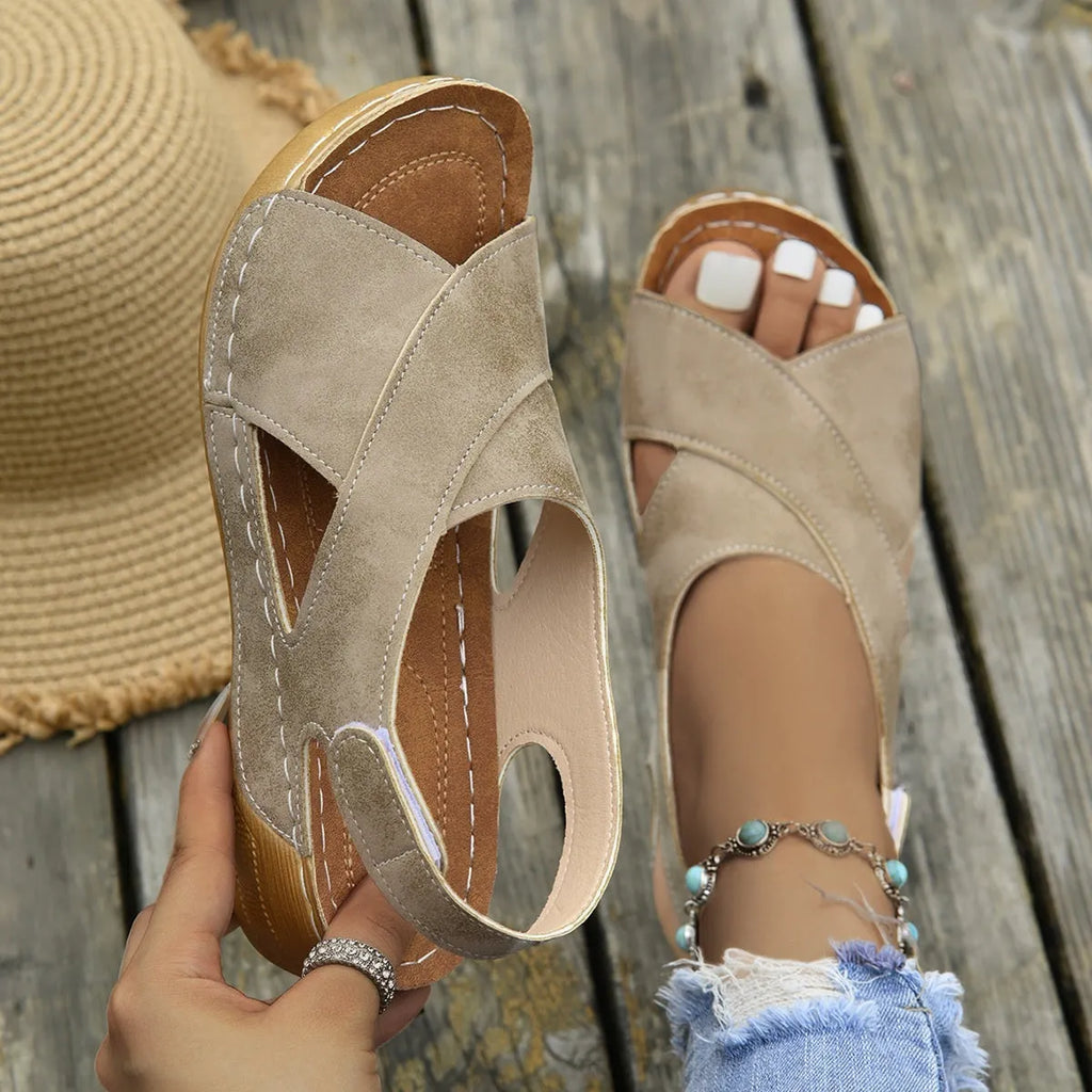 Roman platform sandals with ankle skirt and adjustable Velcro straps in a khaki colour.