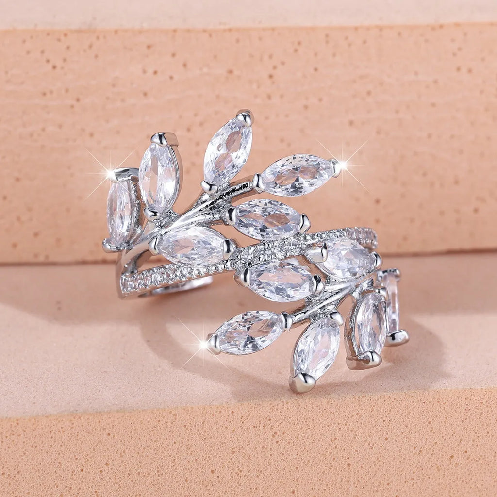 Adjustable copper leaf fashion ring with a central horse eye zircon stone, shown in a rose gold finish.