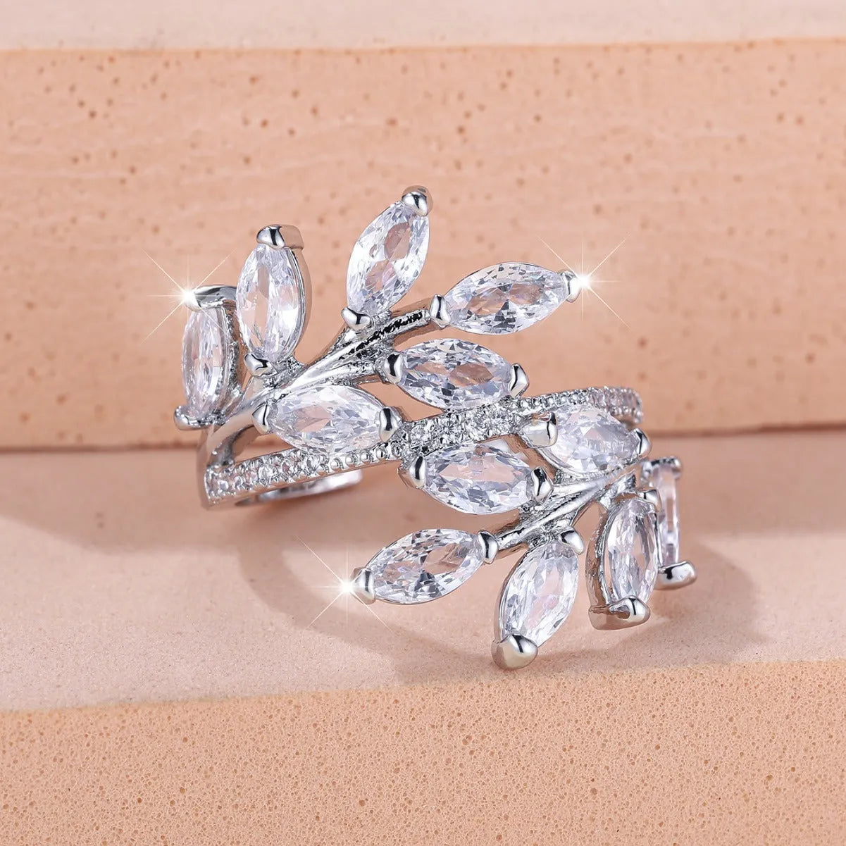 Adjustable copper leaf fashion ring with a central horse eye zircon stone, shown in a rose gold finish.