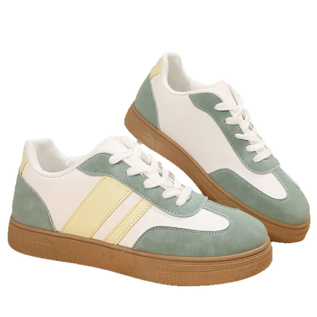 Women's green retro casual trainers with cross straps and round toe design on rubber sole