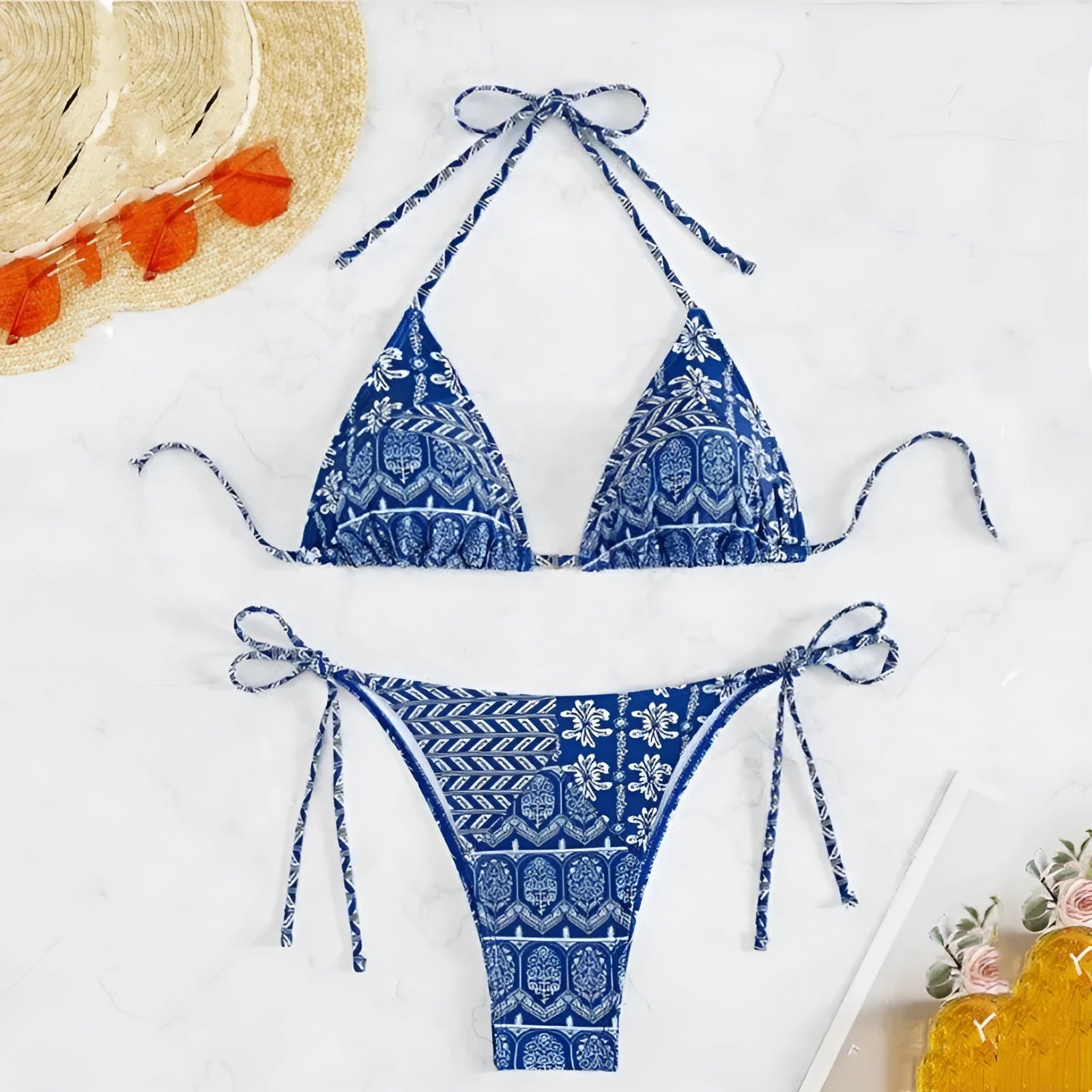 Women's green split bandage bikini with printed stitching on a mannequin.