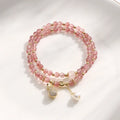 Women's strawberry quartz crystal bracelet with geometric shapes for money drawing