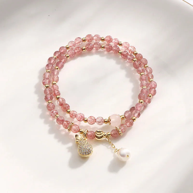 Women's strawberry quartz crystal bracelet with geometric shapes for money drawing
