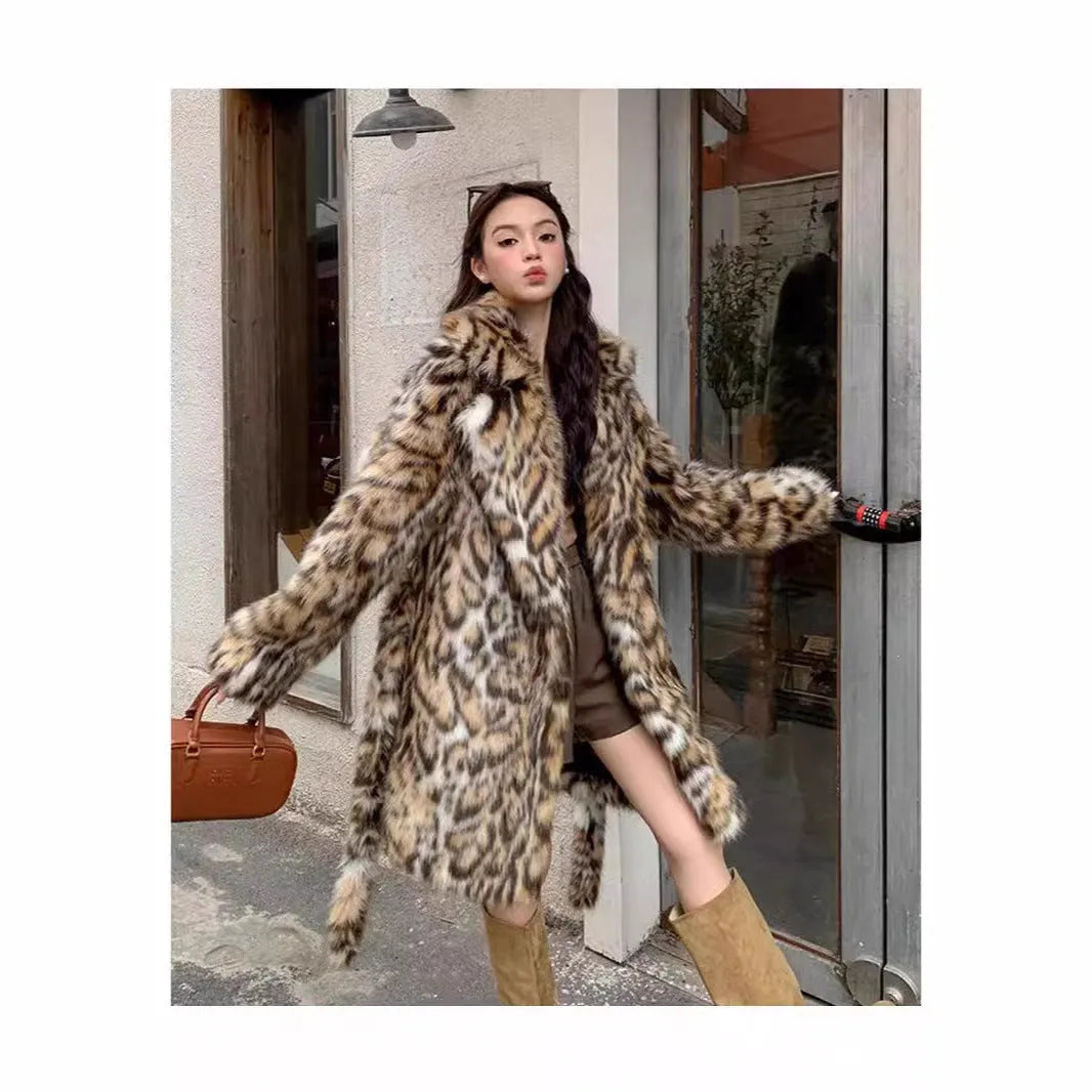 Long faux fur coat with a textured fox fur collar and side pockets.