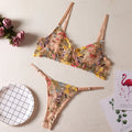 Women's floral pure desire style bikini underwear set in polyester fabric on a mannequin.