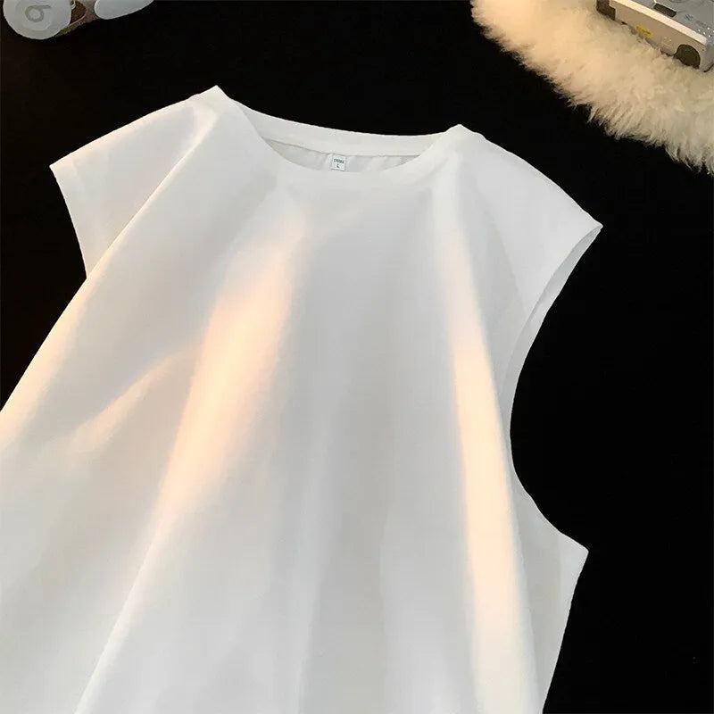 Men's loose fit solid colour cotton tank top shown in a selection of available colours and sizes.