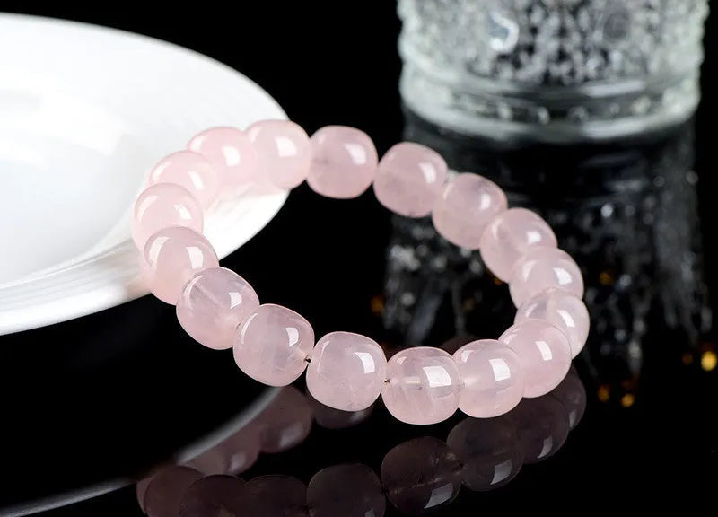 Pink natural bamboo crystal barrel bead bracelet with 11x12mm beads and geometric design.