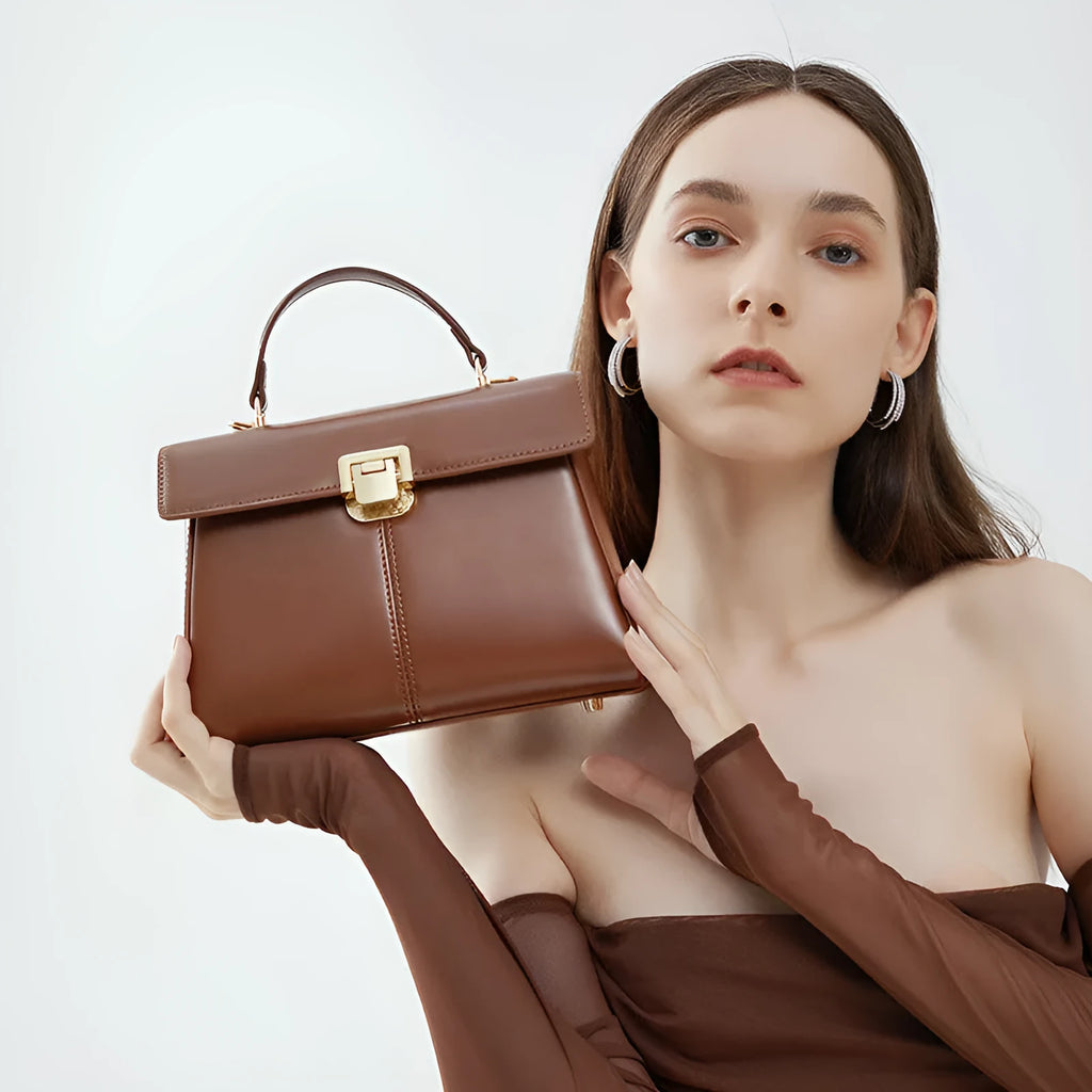 Dark brown women's genuine leather shoulder bag with a metal Vachette clasp, shown open to reveal an interior zippered pocket.