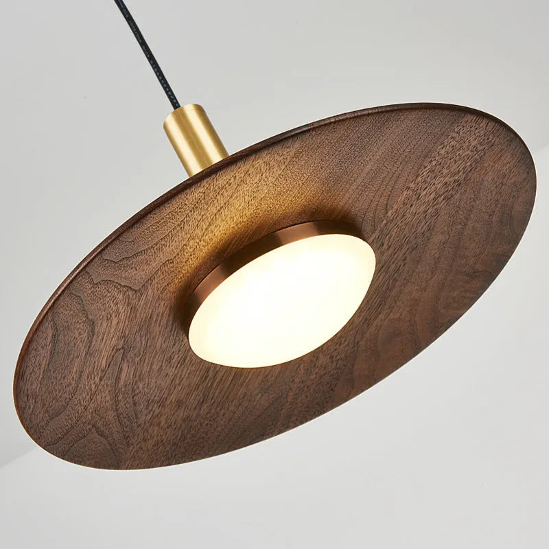 Wood and copper bar-style chandelier light fixture with push-button switch.