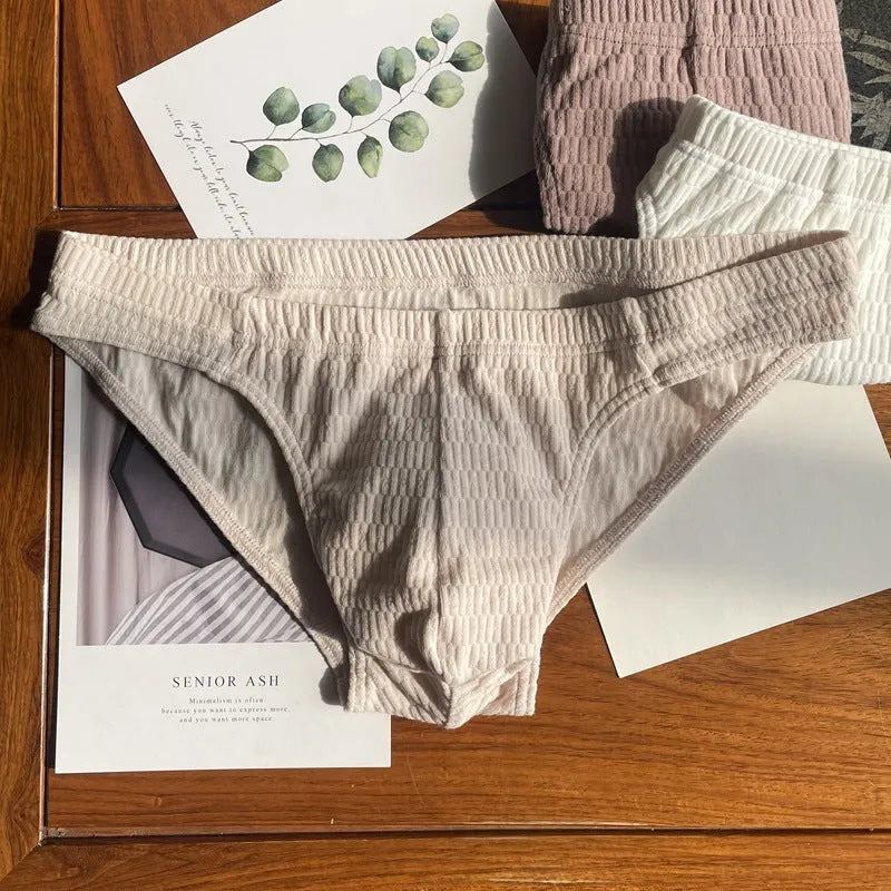 Men's solid colour cotton triangle underwear briefs showing mid waist design and available colour options