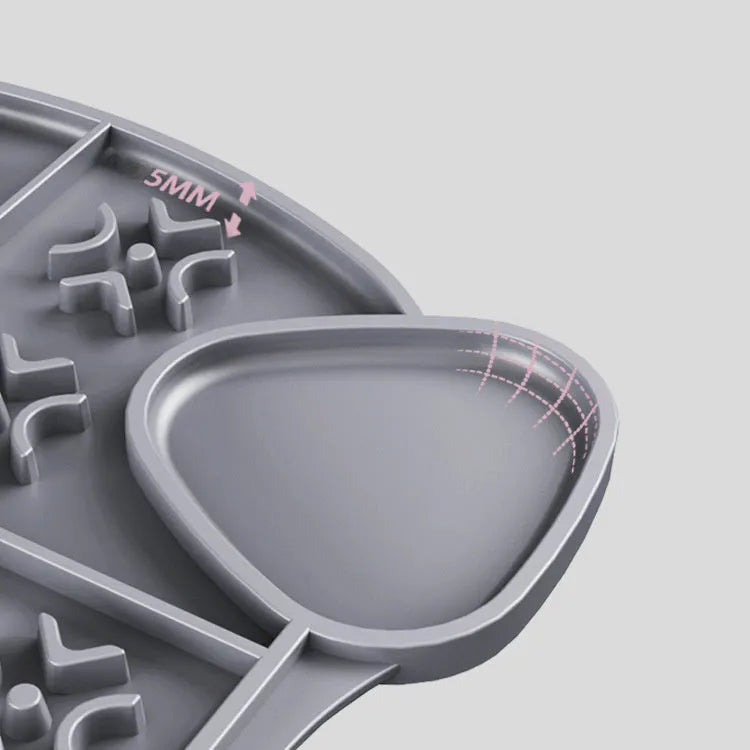 Gray silicone pet slow food pad with suction cups under a pet bowl