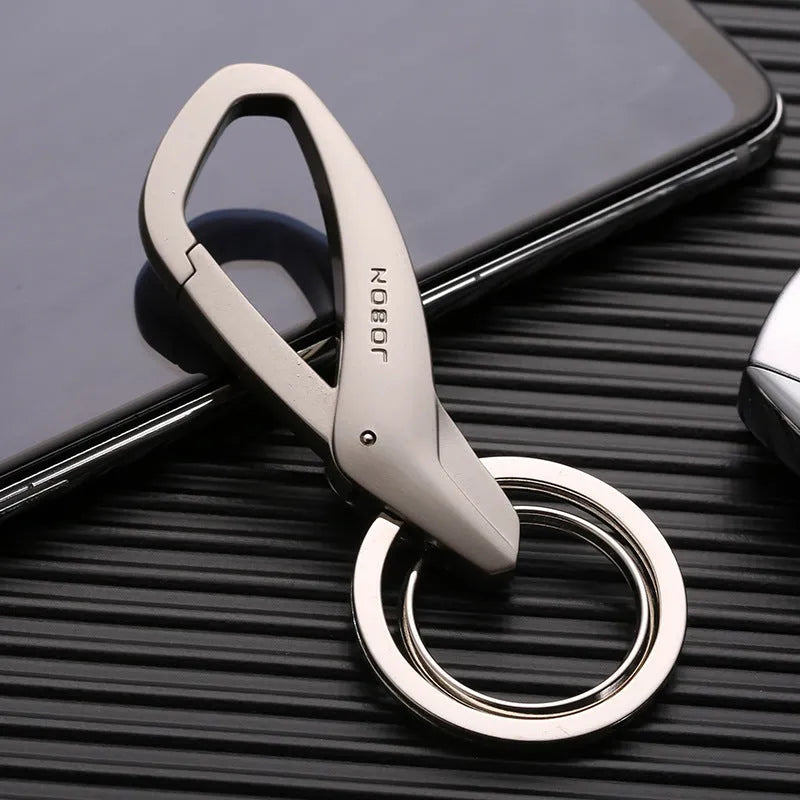 Black zinc alloy double ring keychain for car keys, shown attached to a belt loop.