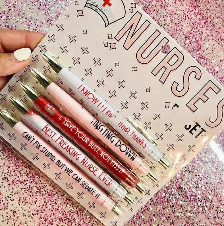 Set of five plastic retractable ballpoint pens with nurse-themed designs on the barrels.