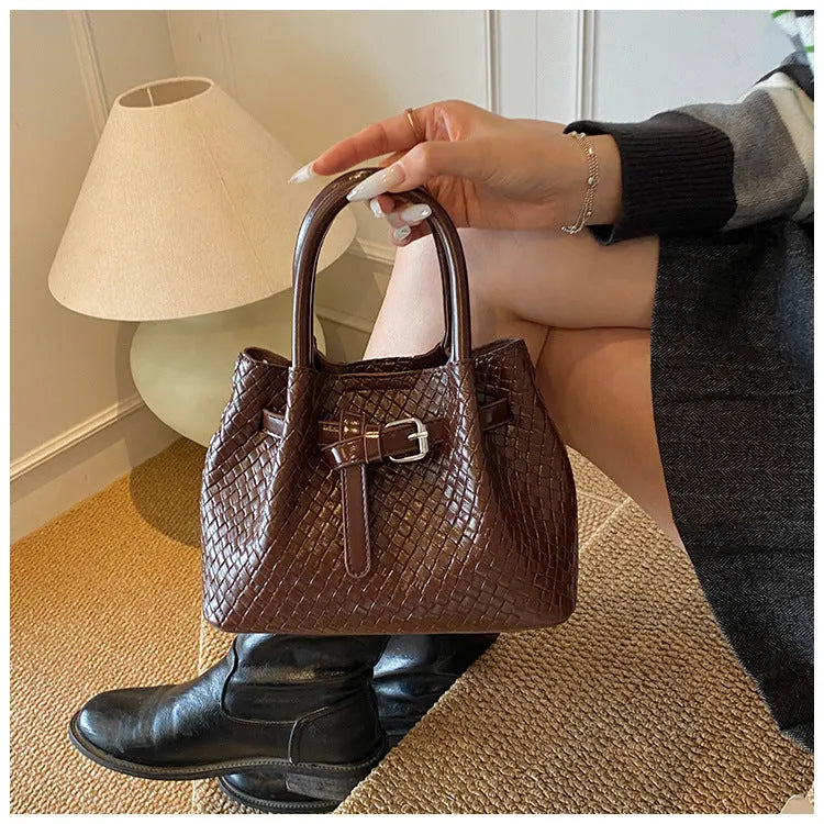 Soft PU bucket messenger handbag for women with spliced exterior and outer pocket, black colour option
