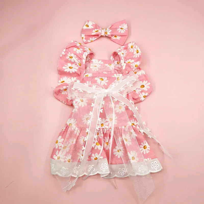 Breathable lace and plaid gauze dog skirt in Pink Daisy with matching bow necklace on a small dog