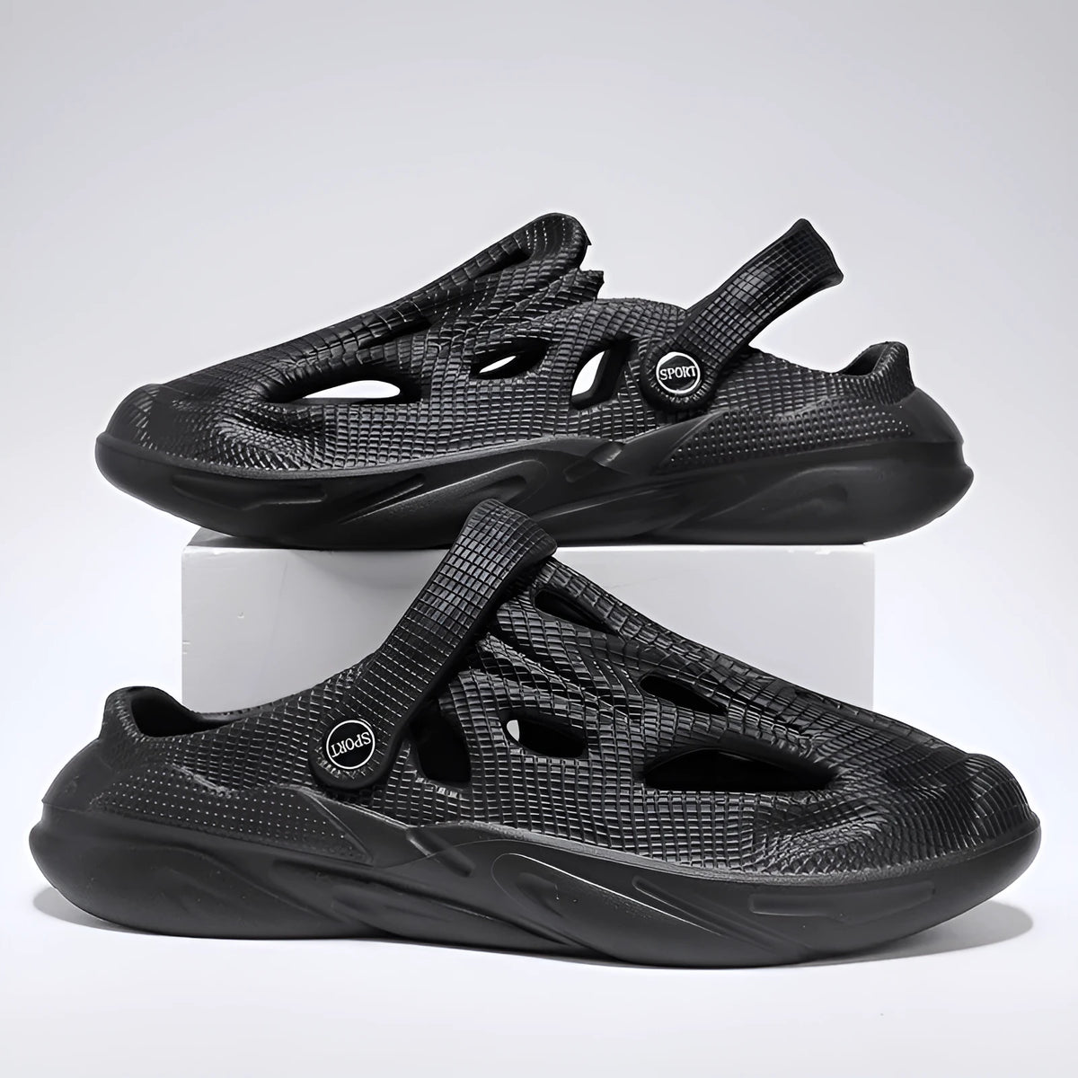 Men's breathable hollow EVA slippers in black with round toe and flat heel