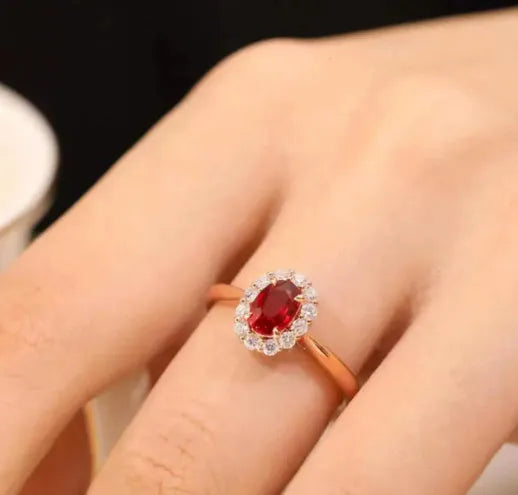 Gold pigeon motif women's ring with red blood ruby artificial gemstone and floral design in silver and gold plating