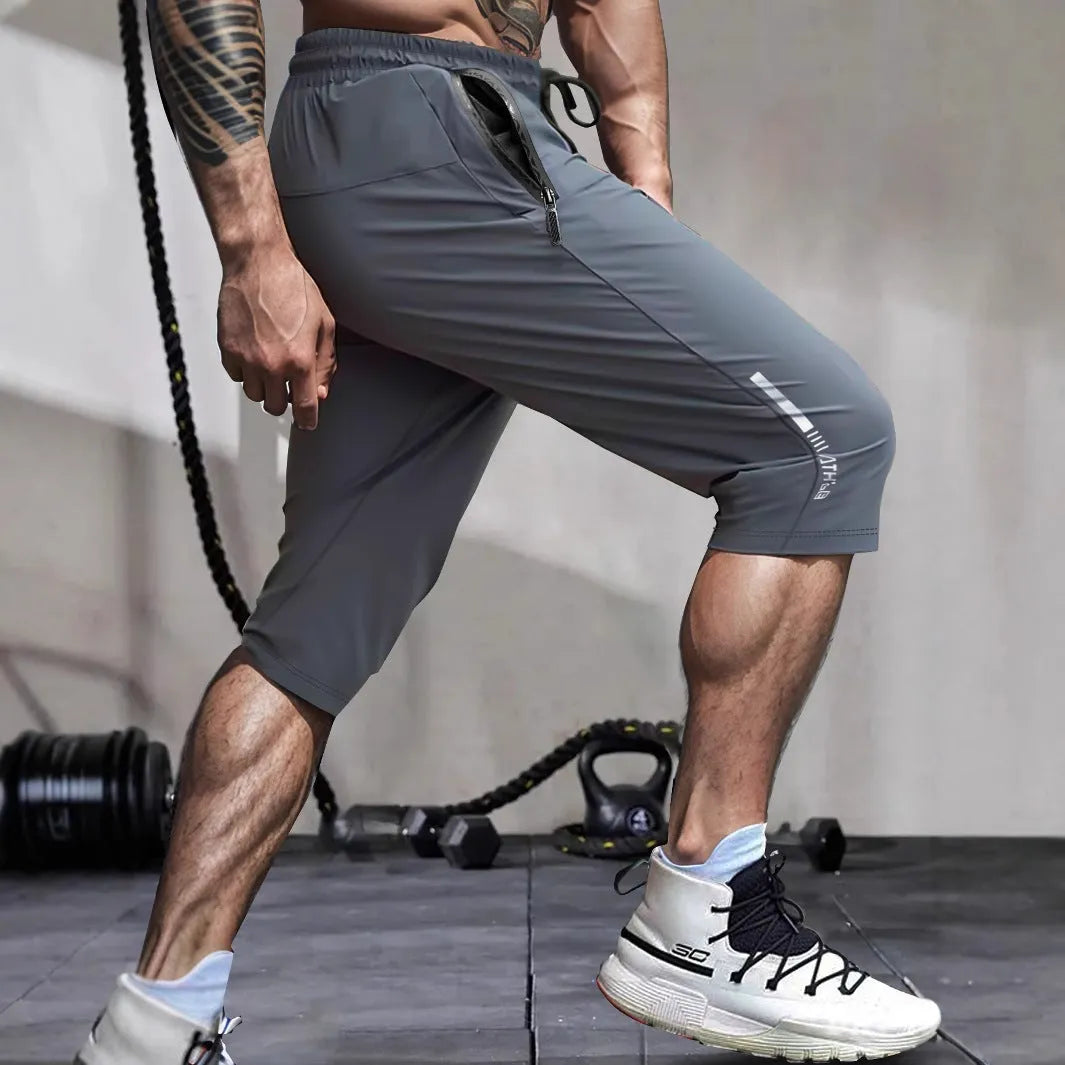 Men's black cropped sports pants with straight-leg cut and quick-drying nylon fabric