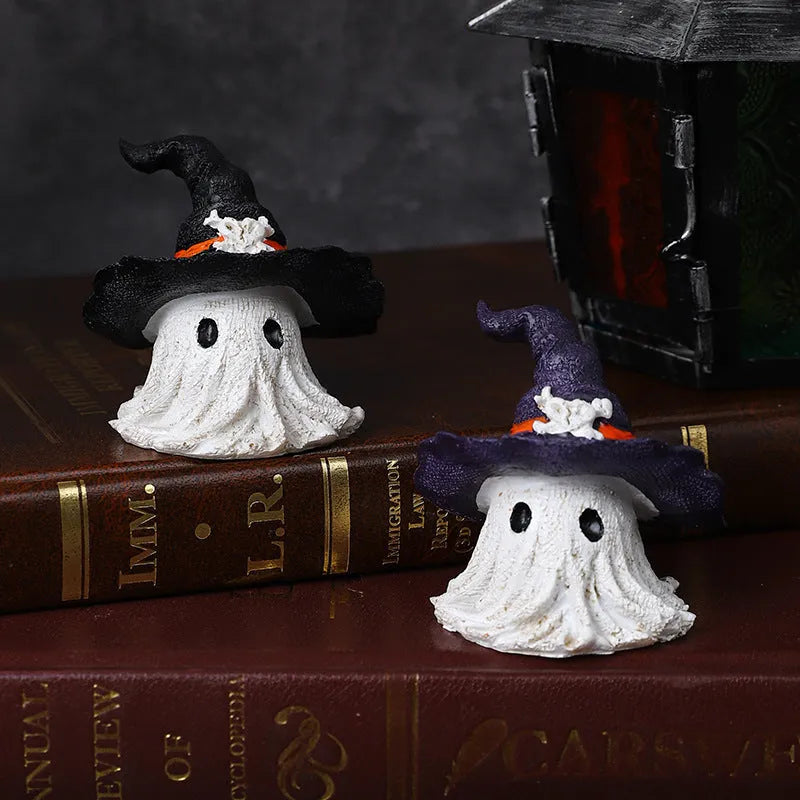 A purple and a black solid resin wizard hat ornament for holiday decoration.