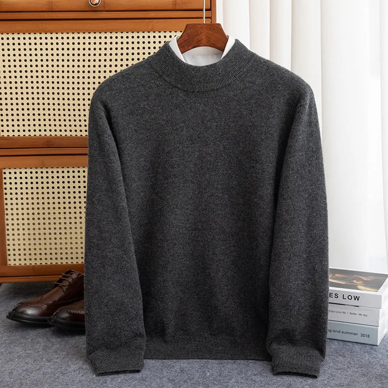 Man wearing a chunky knit half-turtleneck wool sweater in a loose fit.
