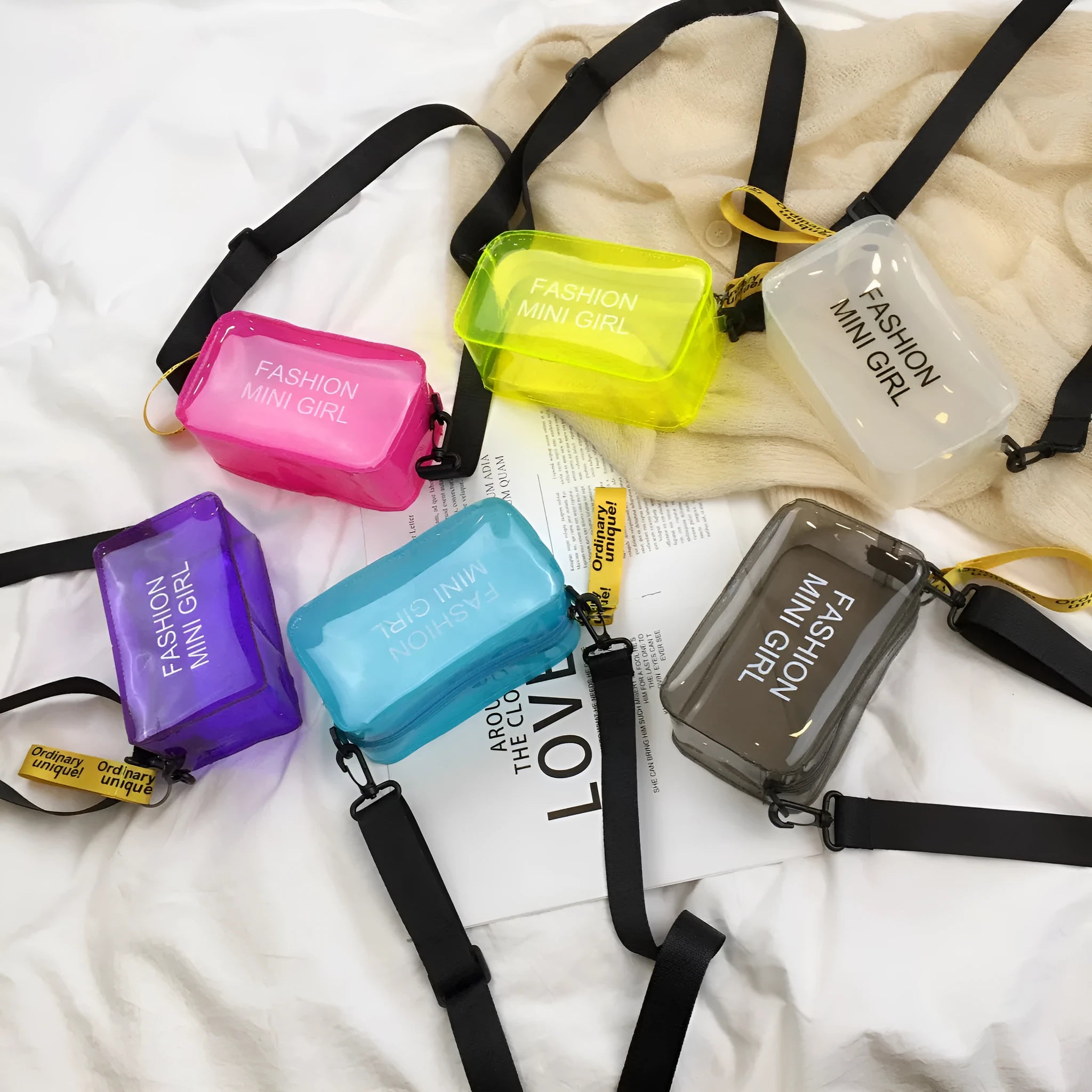 Transparent square jelly women's shoulder bag with a long adjustable strap, shown in a light colour.