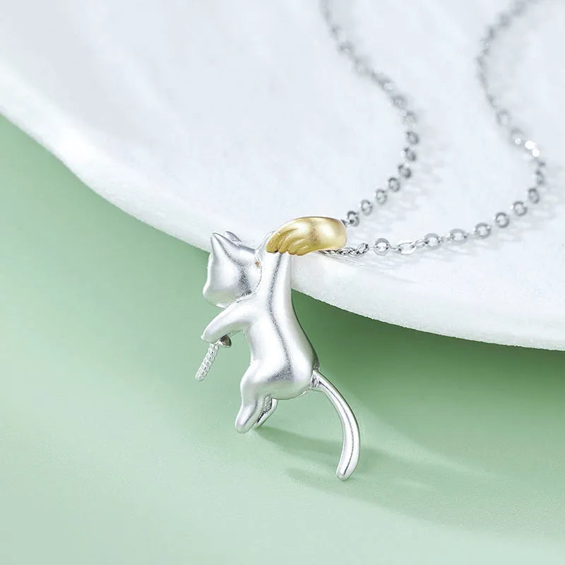 925 sterling silver clavicle necklace with a cat charm pendant on a model.