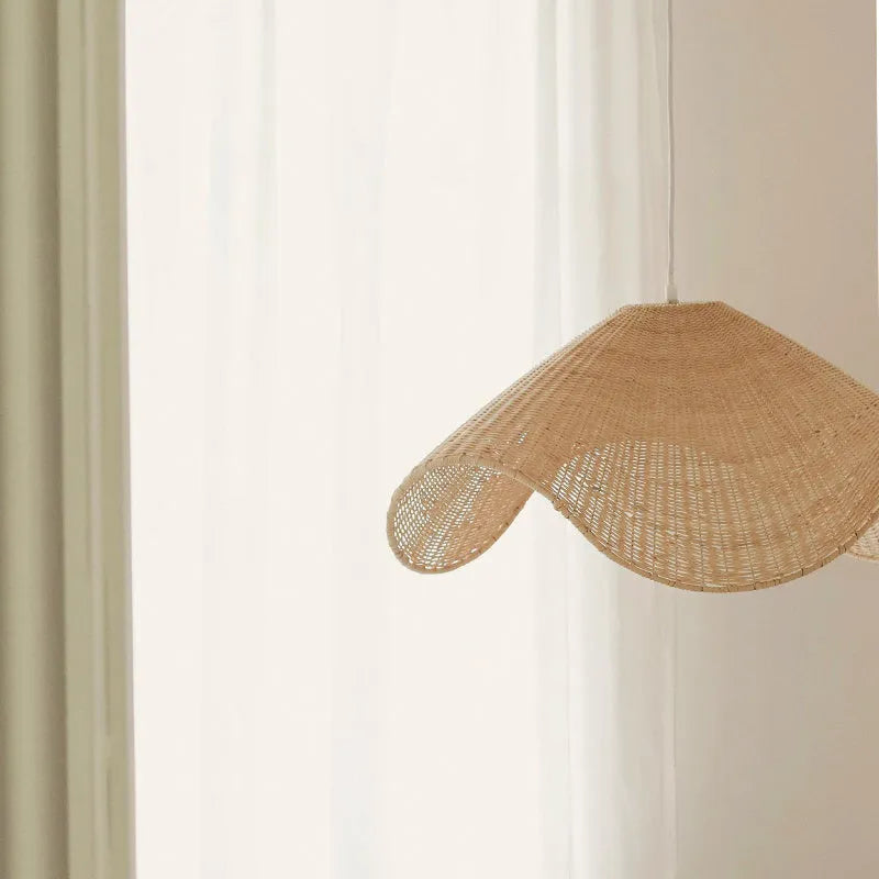 Handmade natural rattan and willow pendant chandelier with warm LED light.